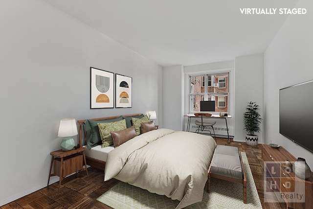 bedroom featuring baseboards