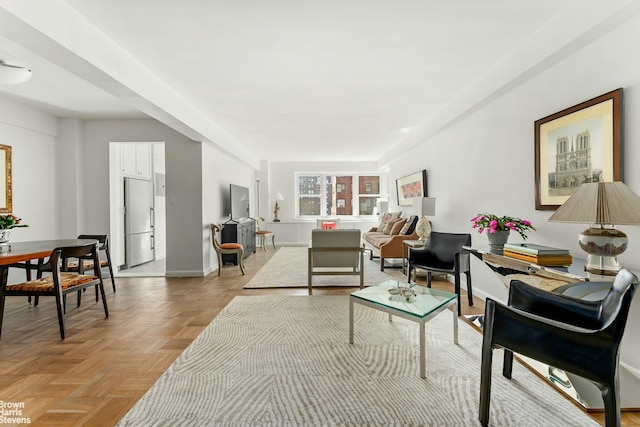 living room featuring baseboards