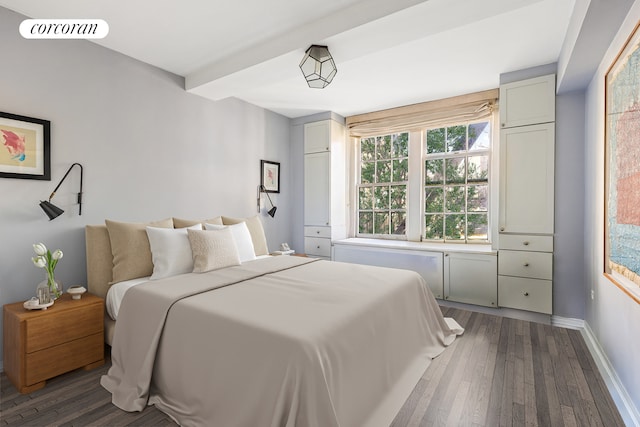 bedroom with hardwood / wood-style flooring, baseboards, and visible vents