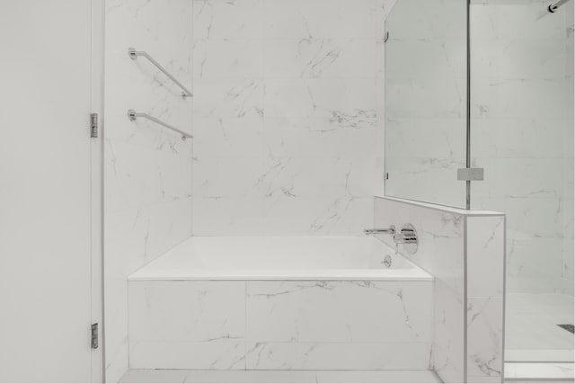 20 Vanderbilt Ave, New York City, NY 11205 - bathroom with a tub with marble appearance and a marble finish shower