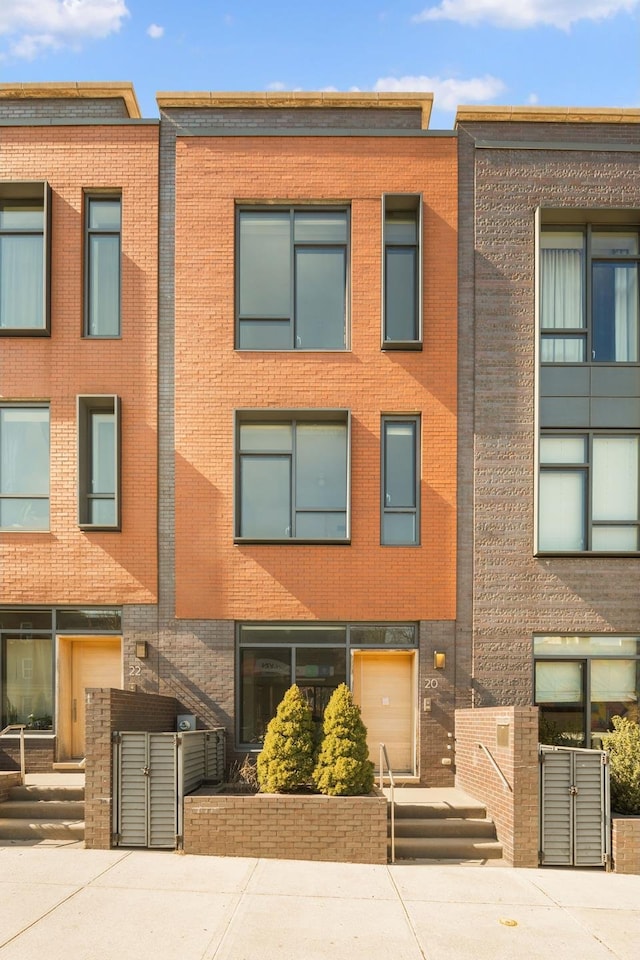 view of property featuring brick siding