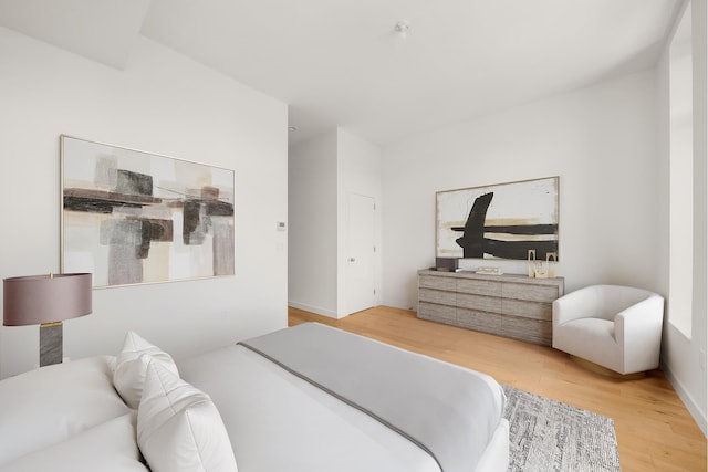 bedroom with wood finished floors