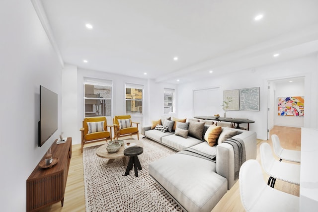 living area featuring recessed lighting and light wood-style flooring