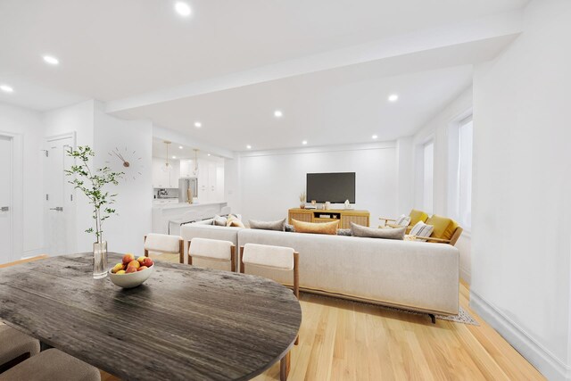 living room with recessed lighting and light wood-style floors