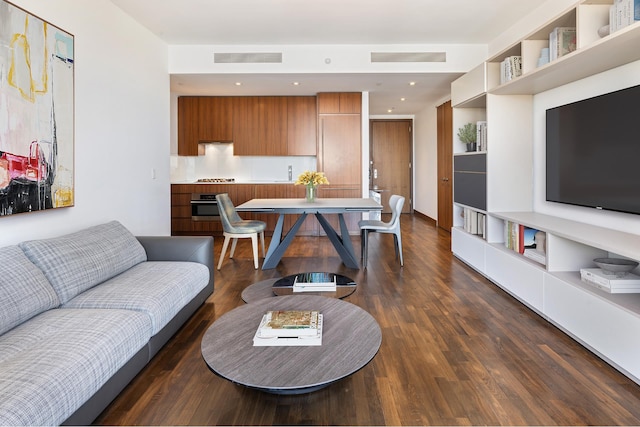 living room featuring visible vents, recessed lighting, and dark wood-type flooring