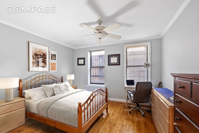 bedroom with ceiling fan, crown molding, light wood-type flooring, and baseboards