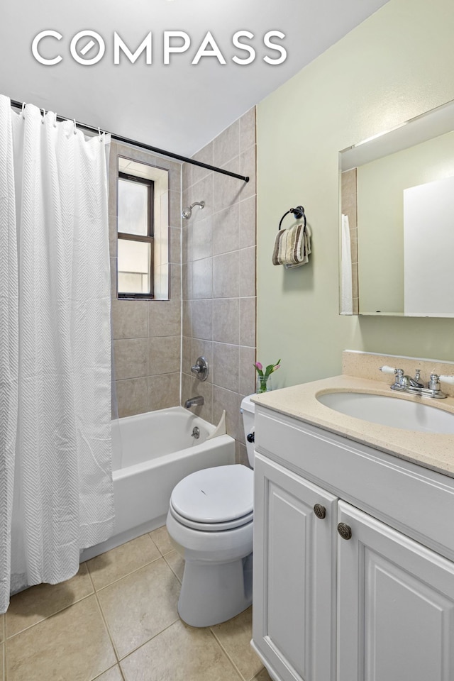 full bath featuring tile patterned flooring, toilet, vanity, and shower / bathtub combination with curtain