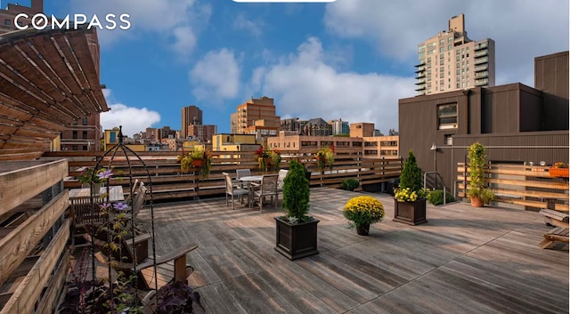 wooden deck featuring a view of city