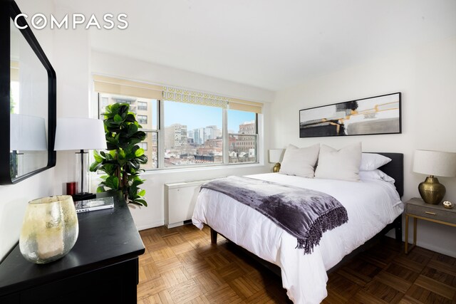bedroom featuring a city view