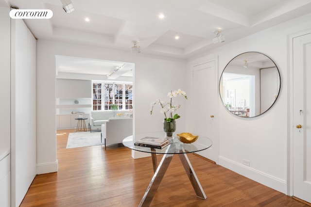 interior space featuring hardwood / wood-style floors, visible vents, recessed lighting, and a raised ceiling