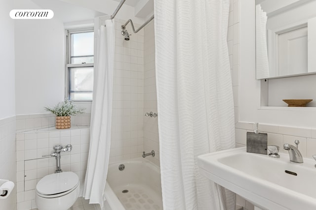 bathroom with shower / bath combo, a sink, toilet, tile walls, and visible vents