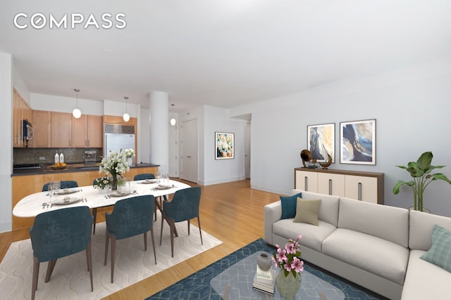 dining room with light wood-type flooring and baseboards