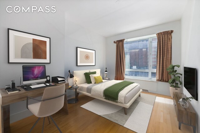 545 W 110th St Unit 2B, New York City, NY 10025 - bedroom featuring wood finished floors and an office area