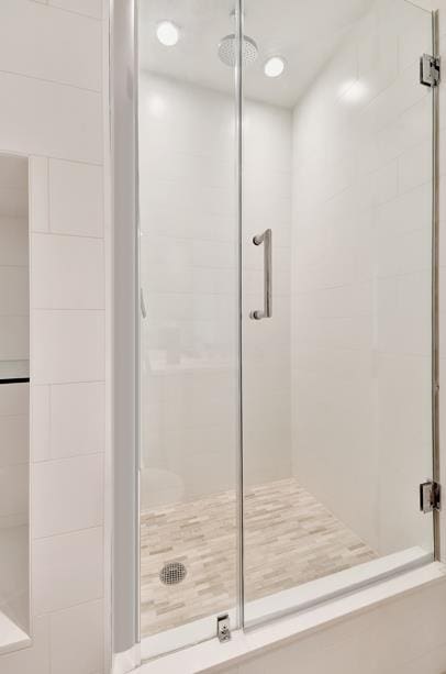 bathroom featuring a shower stall