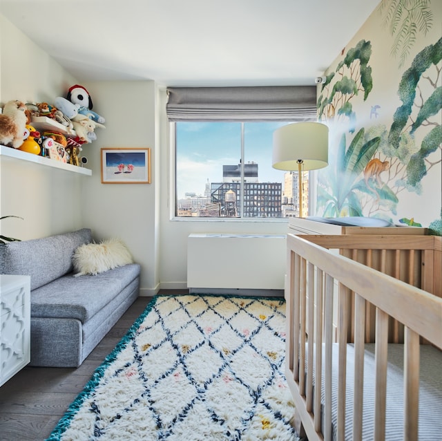 interior space with baseboards and wood finished floors