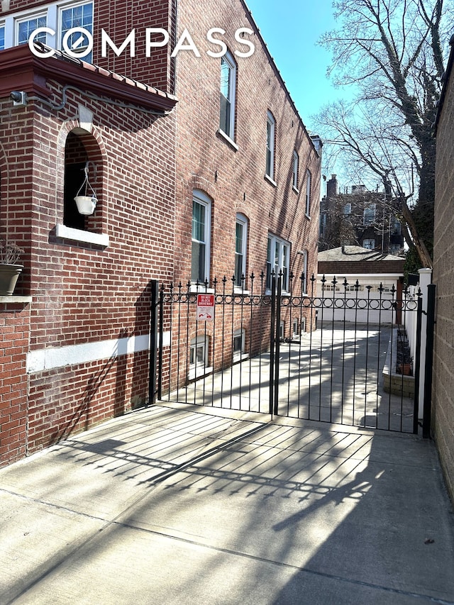 view of gate featuring fence