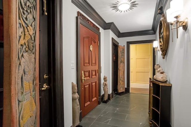 hall with marble finish floor, crown molding, and baseboards