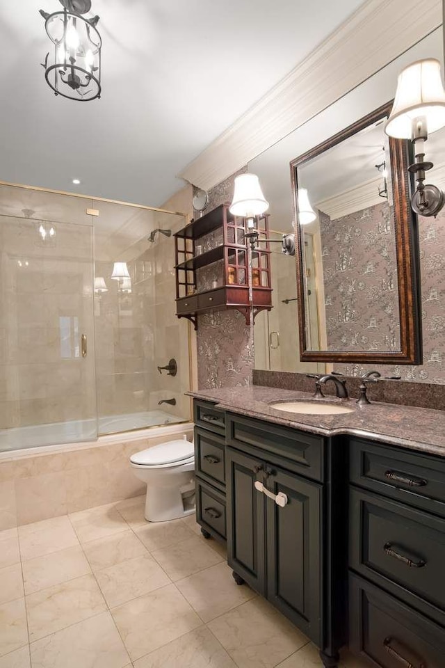 full bathroom featuring tiled shower / bath combo, toilet, and vanity