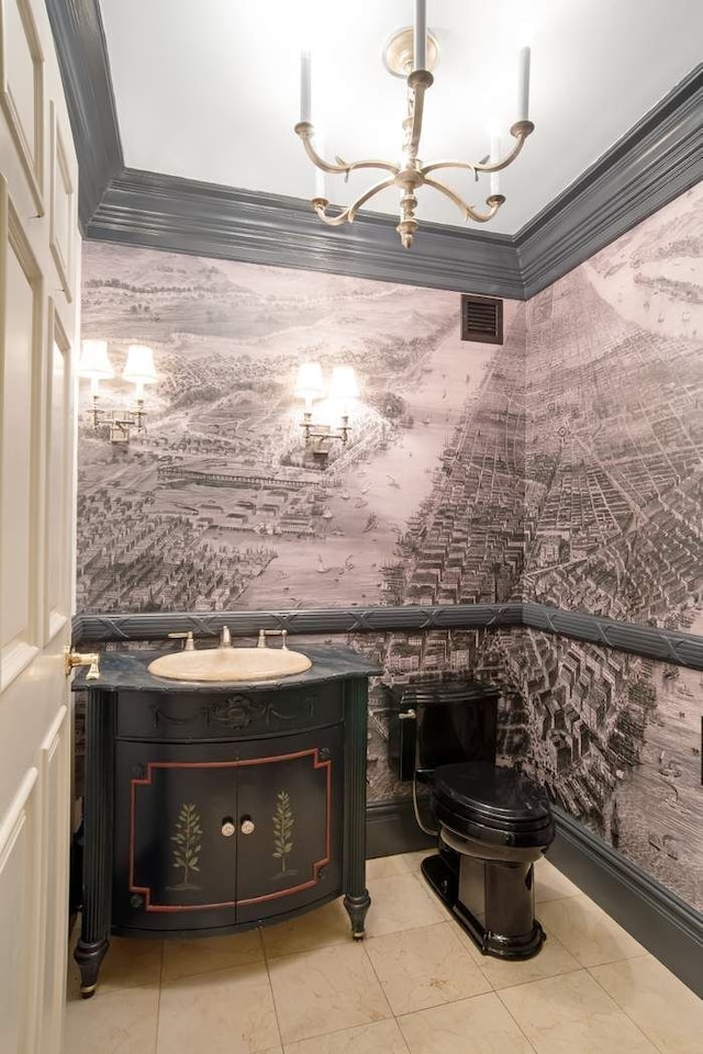 bathroom with wallpapered walls, tile patterned floors, an inviting chandelier, crown molding, and vanity