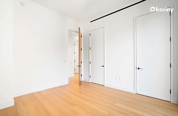 unfurnished bedroom with light wood-style flooring