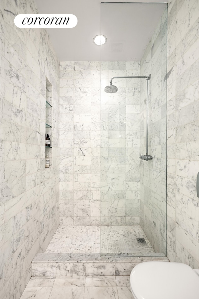 full bathroom with a tile shower