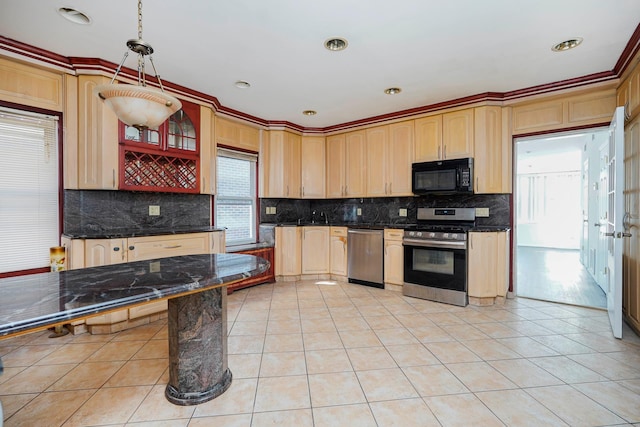 kitchen featuring light tile patterned floors, tasteful backsplash, appliances with stainless steel finishes, and light brown cabinetry