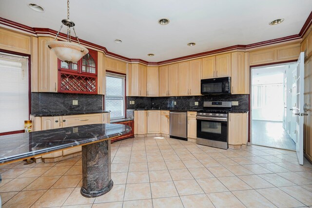 kitchen with tasteful backsplash, appliances with stainless steel finishes, light tile patterned flooring, and light brown cabinets