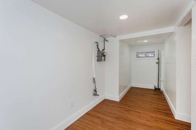 empty room with wood finished floors and baseboards