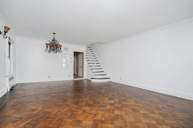 unfurnished living room featuring stairway, baseboards, a chandelier, and ornamental molding