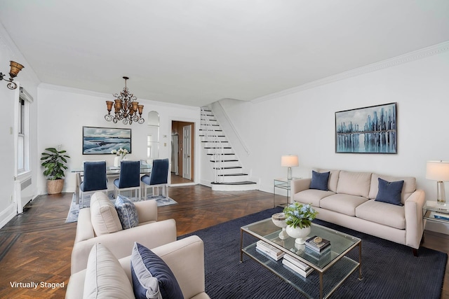 living room featuring stairs, a notable chandelier, and ornamental molding