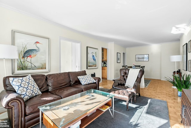 living area featuring ornamental molding and baseboards