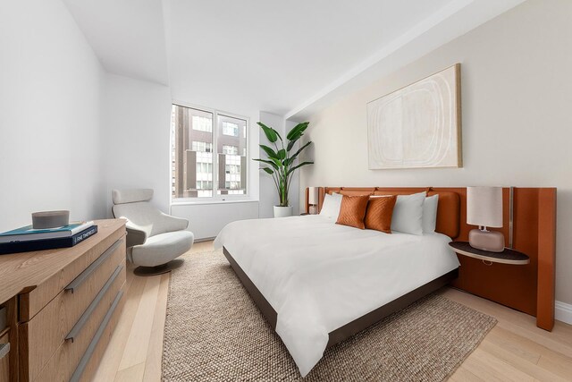 bedroom featuring light wood finished floors