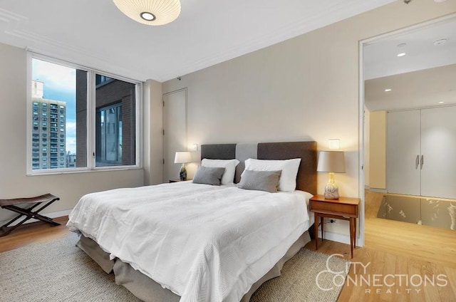 15 W 63rd St Unit 21-A, New York City, NY 10023 - bedroom with wood finished floors and multiple windows