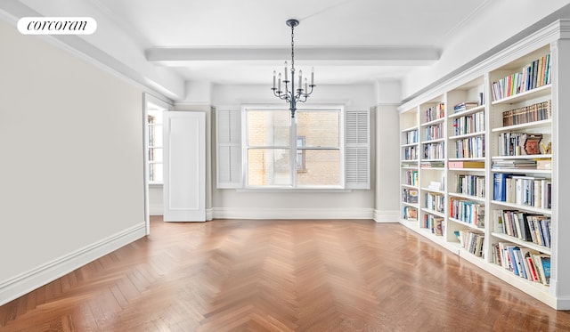 unfurnished dining area featuring visible vents, baseboards, and an inviting chandelier