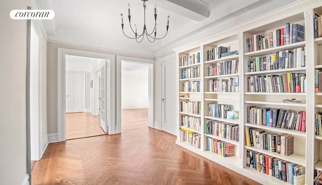 hallway with an inviting chandelier and visible vents