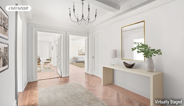 hallway with a chandelier