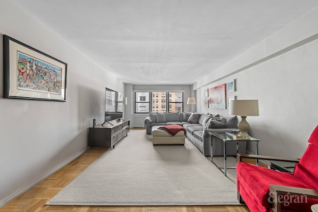 living area featuring radiator heating unit and baseboards