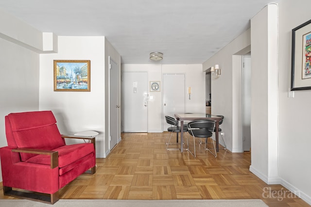 interior space featuring baseboards