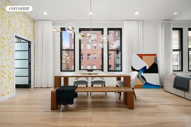 dining space featuring wallpapered walls, visible vents, wood finished floors, and recessed lighting