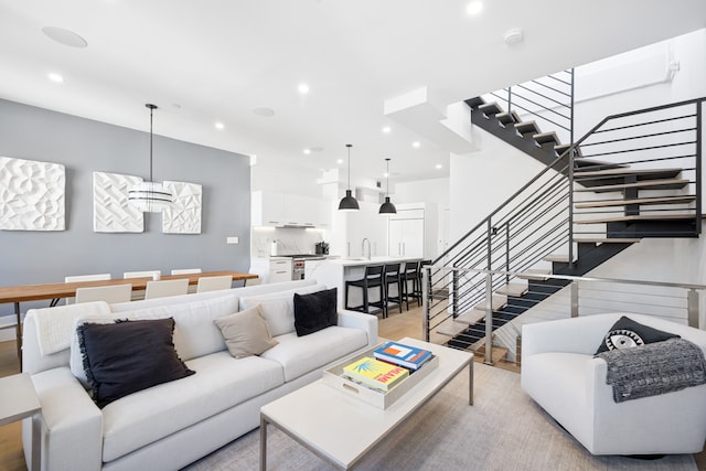 living area with stairway and recessed lighting