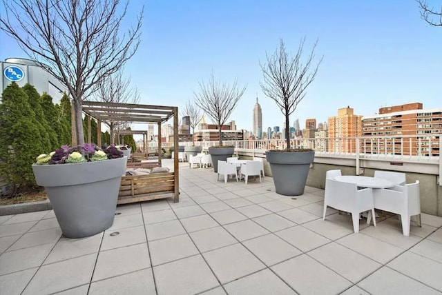 view of patio / terrace with a city view and a pergola