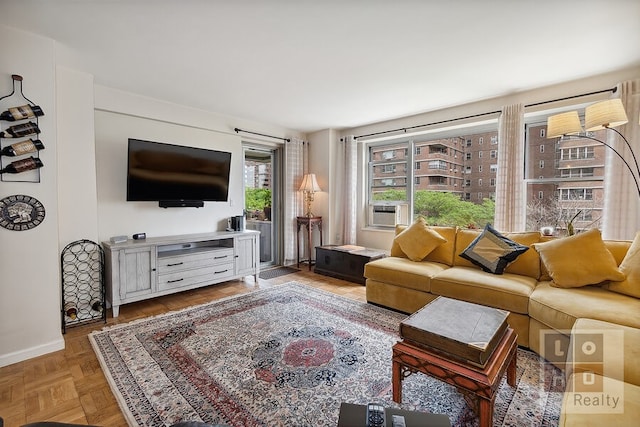 living area featuring baseboards