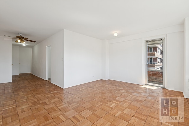 spare room with a ceiling fan