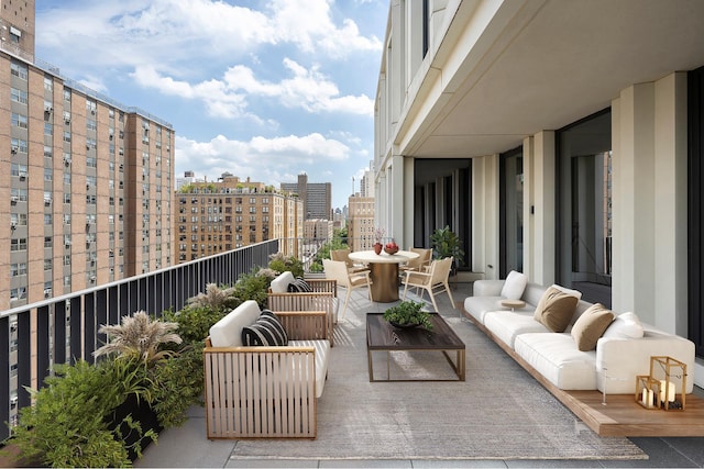balcony with a city view and outdoor lounge area