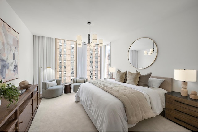 bedroom featuring carpet flooring and a chandelier