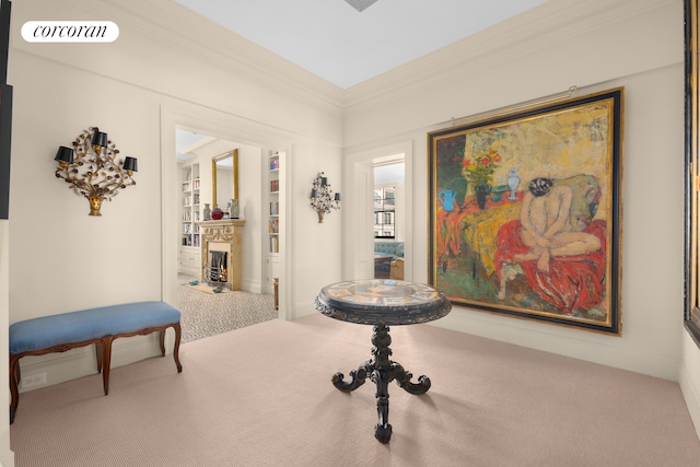 hallway featuring visible vents, carpet floors, and ornamental molding