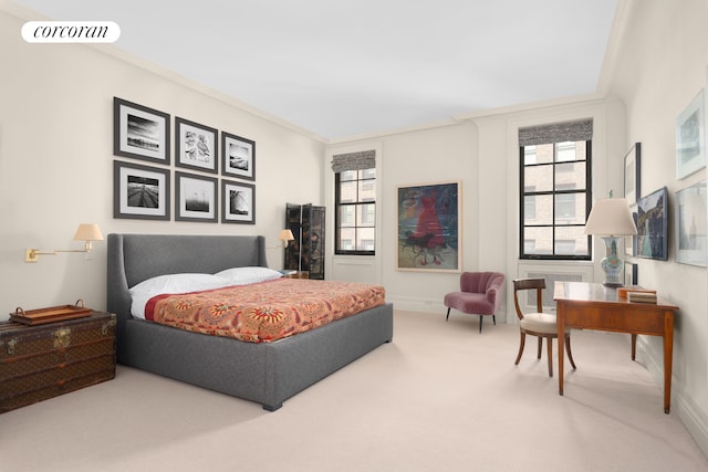 bedroom featuring visible vents, multiple windows, carpet floors, and ornamental molding