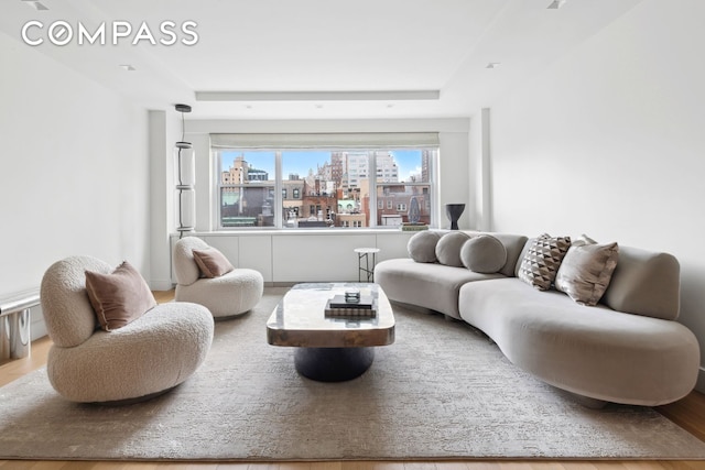 living area featuring a view of city and wood finished floors