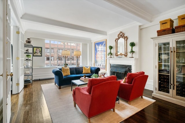 living room with a fireplace, wood finished floors, beam ceiling, and crown molding