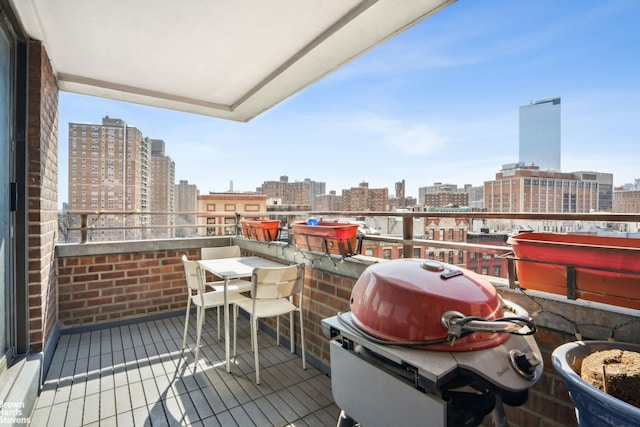 balcony with a grill and a view of city